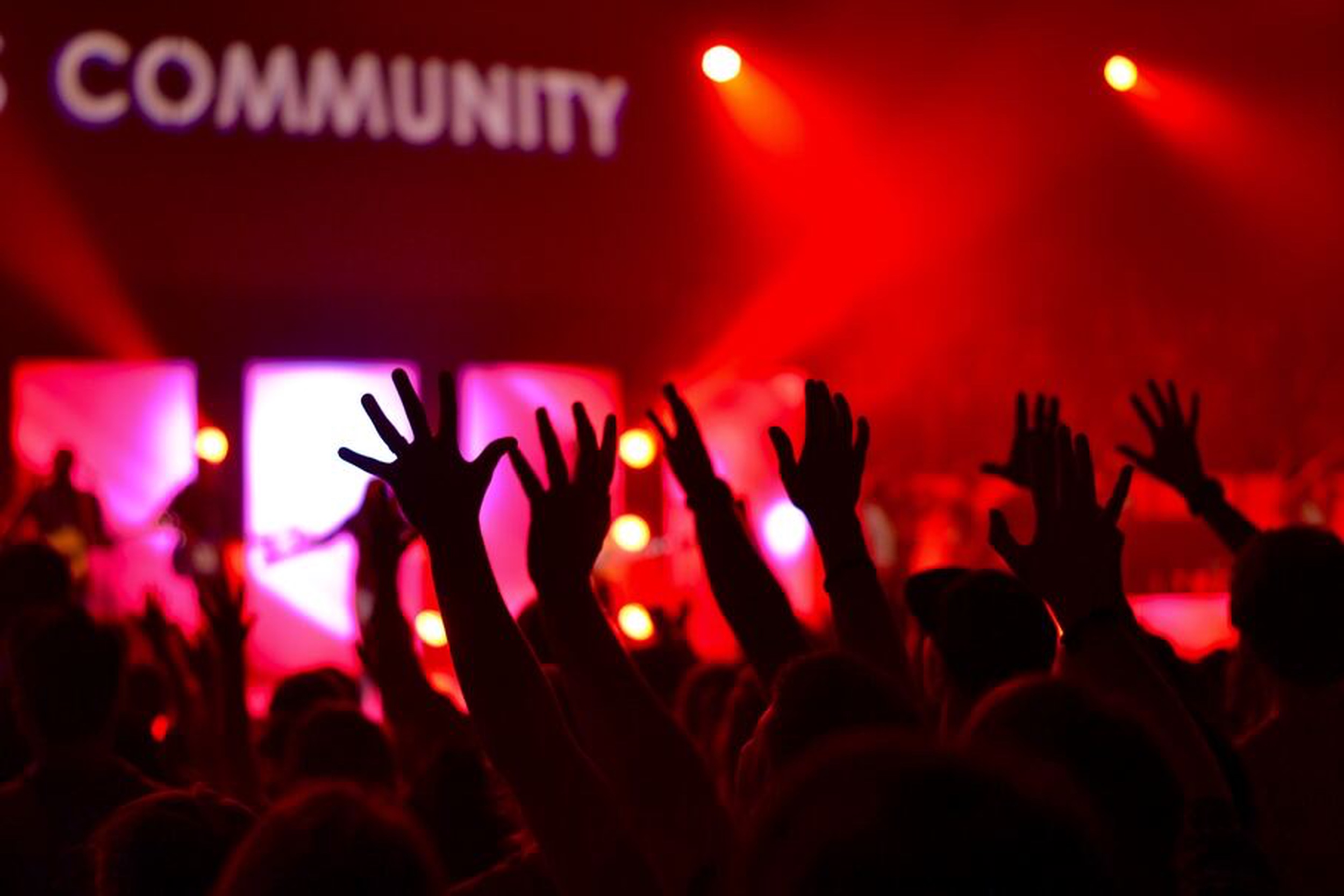 Independent musician networking at a music event to grow their music career through music industry connections.