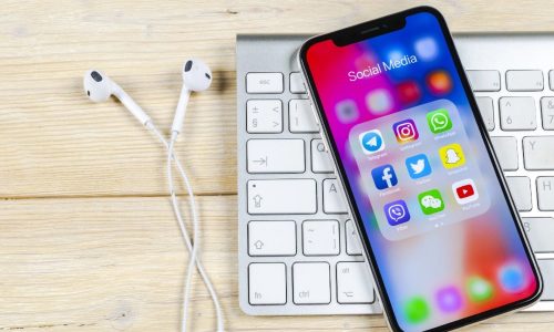 Musician working on side hustle services like mixing, mentoring, and sample packs in a home studio.