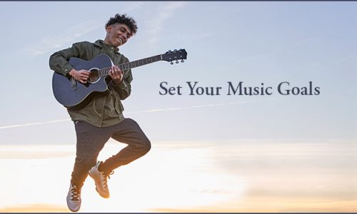 Musician planning music career goals with notes, laptop, and calendar.