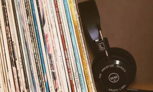 Artist working with a creator-label hybrid model in a modern music studio