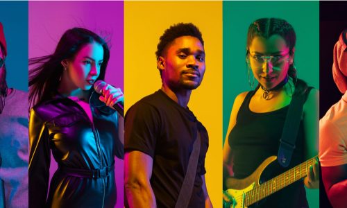 musicians collaborating on stage as part of a cross-promotion strategy